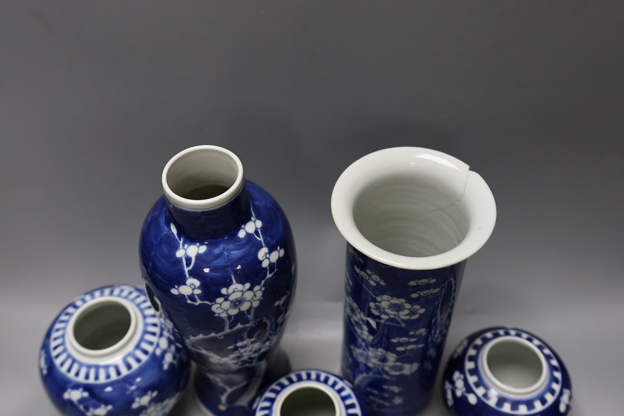 Two 19th / 20th century Chinese blue and white prunus vases and three jars, tallest 29cm